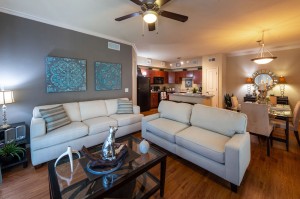 Three Bedroom Apartments for Rent in Conroe, TX - Model Living Room, Dining Room & Kitchen  